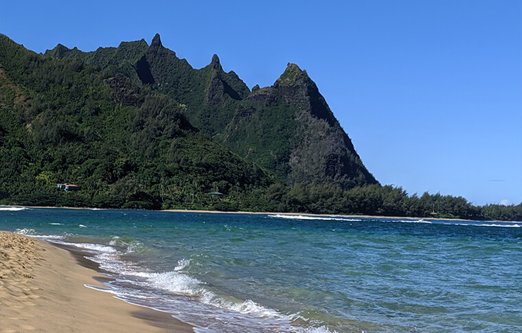 Pointy ridged mountain range next to the beach